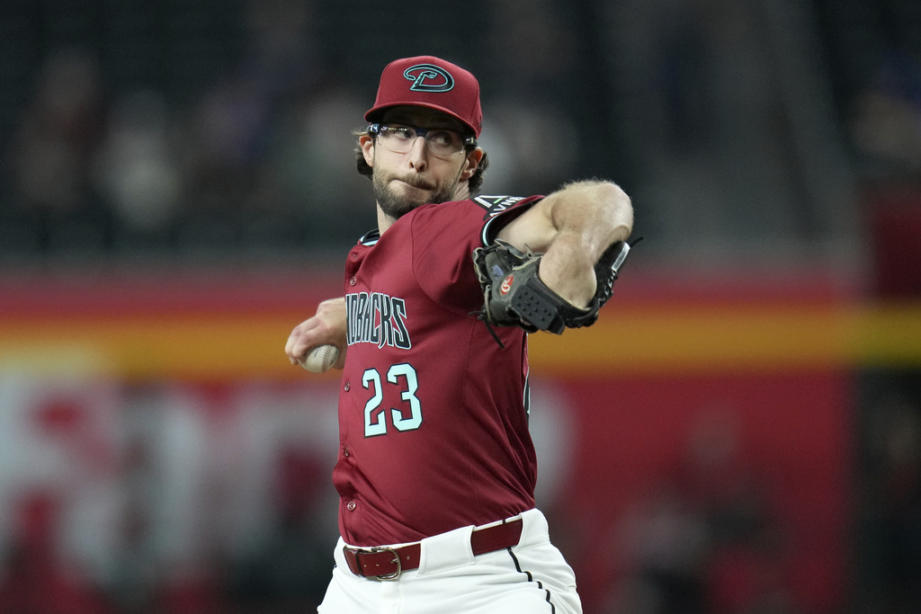 Arizona Diamondbacks starting pitcher Zac Gallen throws against the Texas Rangers during the first inning of a baseball game Wednesday, Sept. 3, 2025, in Phoenix. (AP Photo/Ross D. Franklin)