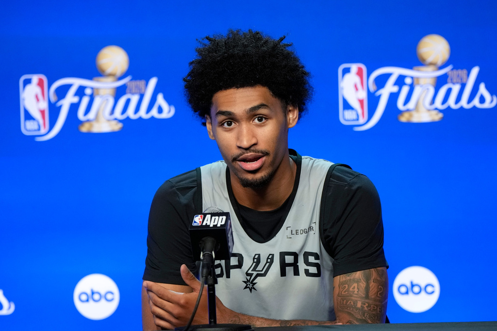 San Antonio Spurs guard Dylan Harper speaks to the media prior to the start of the NBA Finals basketball series against the New York Knicks, Tuesday, June 2, 2026, in San Antonio. (AP Photo/David J. Phillip)
