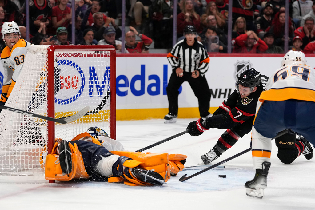 Ottawa Senators' Brady Tkachuk (7) looks for the rebound after a save by Nashville Predators goaltender Juuse Saros during the second period of an NHL hockey game in Ottawa, Ontario, on Monday, Oct. 13, 2025. (Justin Tang/The Canadian Press via AP)