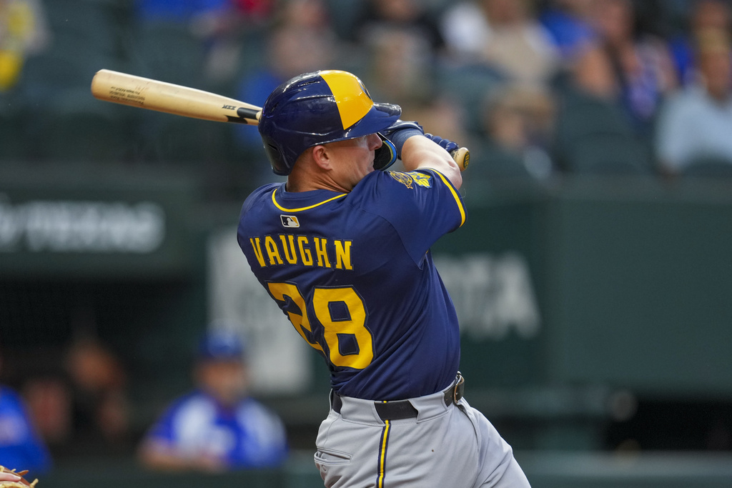 Milwaukee Brewers' Andrew Vaughn follows through while collecting a single against the Texas Rangers during the second inning of a baseball game Monday, Sept. 8, 2025, in Arlington, Texas. (AP Photo/Julio Cortez)