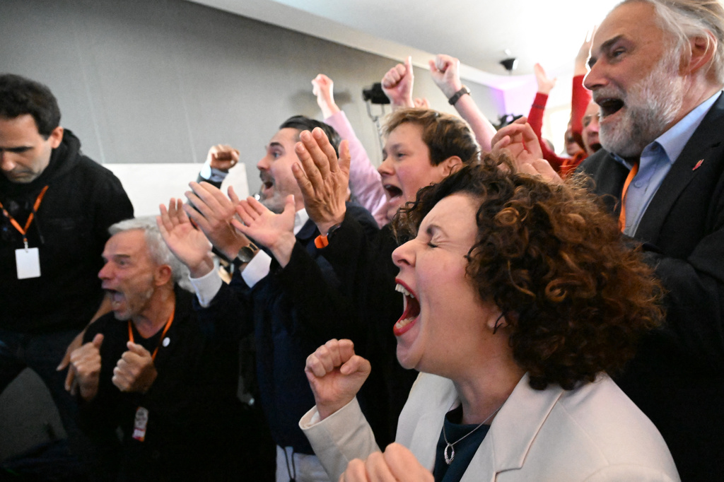 Amira Mohamed Ali, right, reactss to the first projections at the BSW election party in Schwerin, Germany, Sunday, Sept. 20, 2026. (Philip Dulian/dpa via AP)