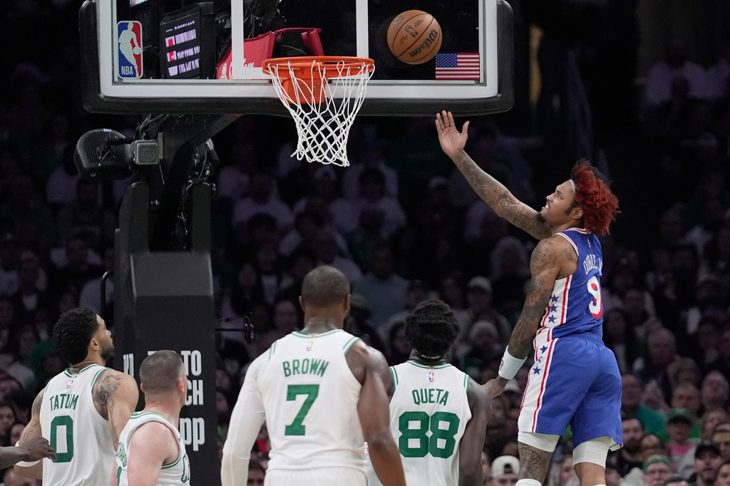 Boston Celtics guard Derrick White (9) goes for a layup against the Boston Celtics during the first half in Game 1 of a first-round NBA playoffs basketball game, Sunday, April 19, 2026, in Boston. (AP Photo/Robert F. Bukaty)