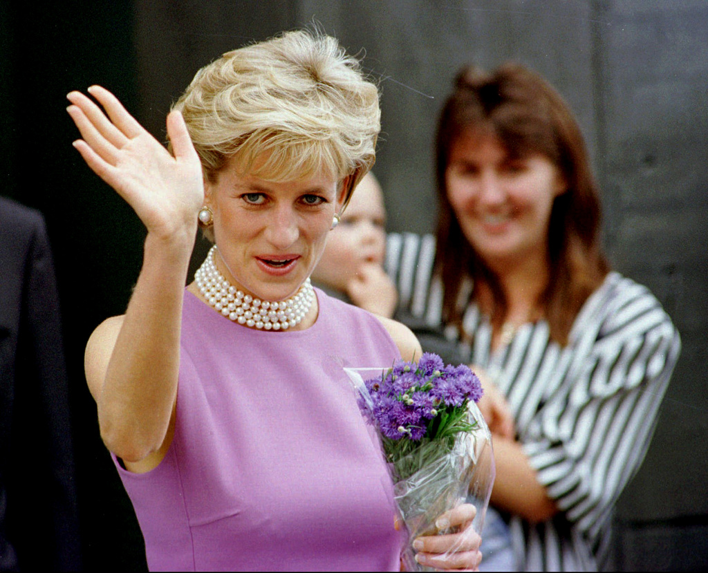 FILE - Diana, Princess of Wales waves to the crowd as she leaves the Victor Chang Cardiac Research Institute in Sydney Australia, Friday, Nov. 1, 1996. (AP Photo/Rick Rycroft, File)