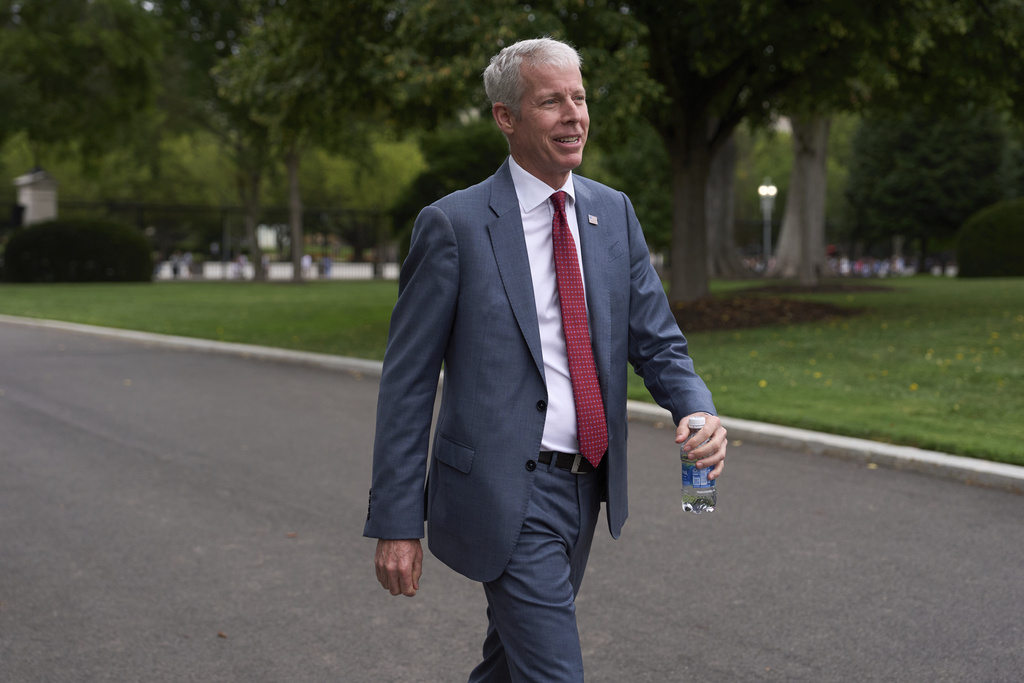 Energy Secretary Chris Wright walks past reporters after doing an interview at the White House, Tuesday, Aug. 19, 2025, in Washington. (AP Photo/Evan Vucci)
