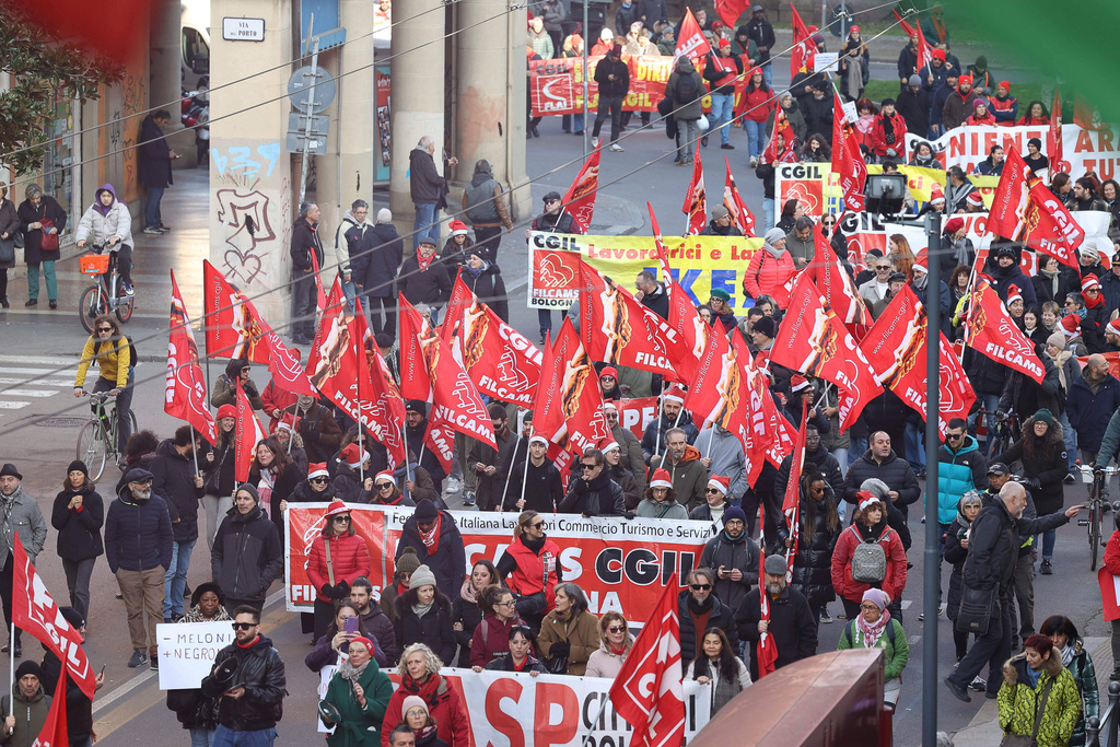 People march on the occasion of a general strike called by the CGIL (Italian General Confederation of Labour) trade union to protest against the budget law in Bologna, Italy, Friday, Dec. 12, 2025. (Guido Calamosca/LaPresse via AP)