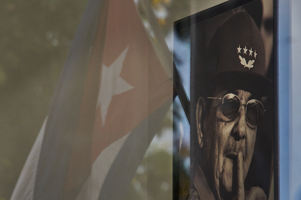 A photo of Raul Castro is seen with a reflected Cuban flag in a state store in Havana, Cuba, Tuesday, June 2, 2026. (AP Photo/Ramon Espinosa)