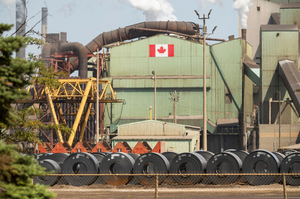 Rolled coils of steel sit in the yard at the ArcelorMittal Dofasco steel plant in Hamilton, Ont. on Thursday, Aug. 20, 2026. (Nick Iwanyshyn /The Canadian Press via AP)