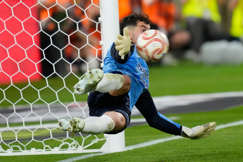 Real Sociedad's goalkeeper Unai Marrero makes a save during during the penalty shoot out at the Copa del Rey final soccer match between Atletico Madrid and Real Sociedad in Seville, Spain, Saturday, April. 18, 2026. (AP Photo/Jose Breton)