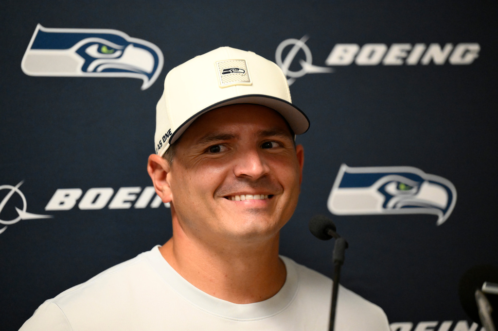 Seattle Seahawks head coach Mike MacDonald listens to a question during a news conference after a preseason NFL football game against the Kansas City Chiefs, Friday, Aug. 28, 2026, in Kansas City, Mo. (AP Photo/Reed Hoffmann)