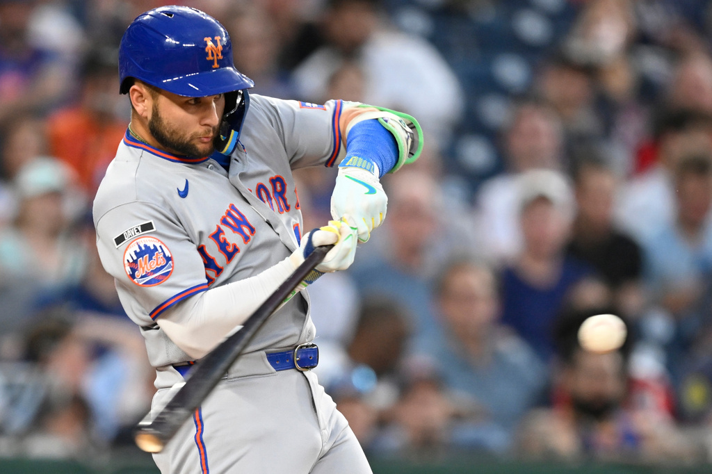 New York Mets' Bo Bichette hits a two run home run during the second inning of a baseball game Washington Nationals, Tuesday, May 19, 2026, in Washington. (AP Photo/John McDonnell)