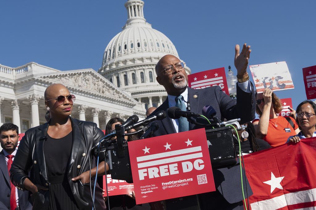 Rep. Ayanna Pressley, D-Mass., left, and Rep. Glenn Ivey, D-Md., center, join elected officials and activists in a call to end the presence of National Guard troops in the District of Columbia at the Capitol in Washington, Thursday, Sept. 4, 2025. (AP Photo/J. Scott Applewhite)