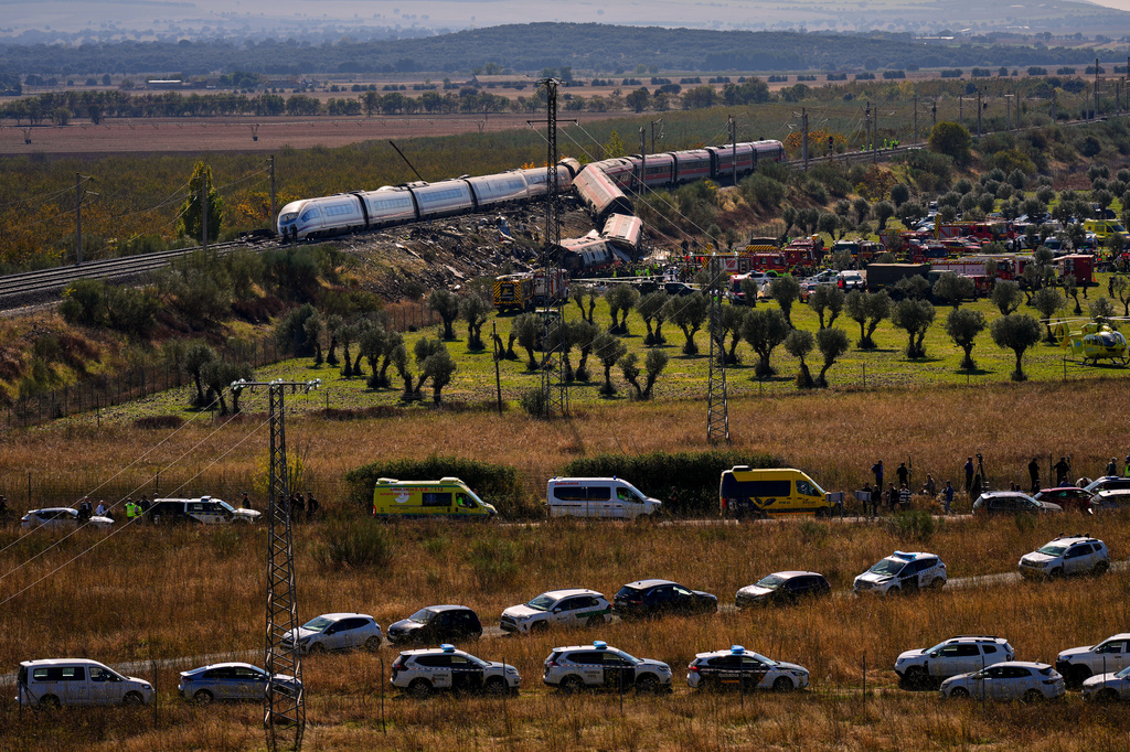 Emergency services work at the scene of a collision between two trains in Urda, Spain, on Wednesday, Oct. 28, 2026. (AP Photo/Manu Fernandez)