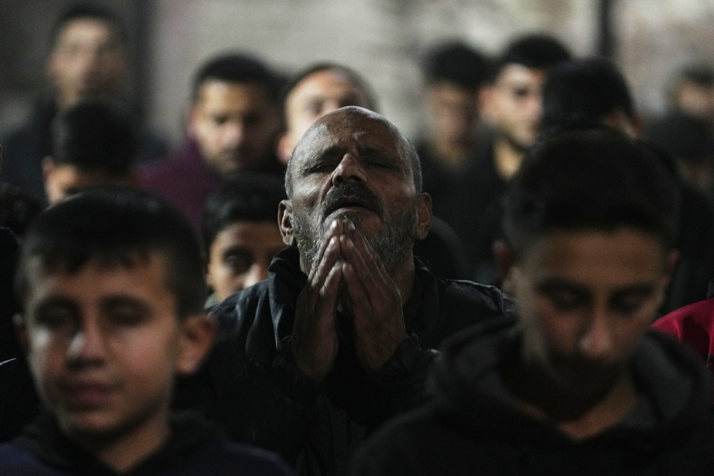 Muslim worshippers perform evening Tarawih prayer on the first night of the holy fasting month of Ramadan at the Great Omari Mosque, which was damaged during the Israel–Hamas war, in Gaza City, Tuesday, Feb. 17, 2026. (AP Photo/Abdel Kareem Hana)