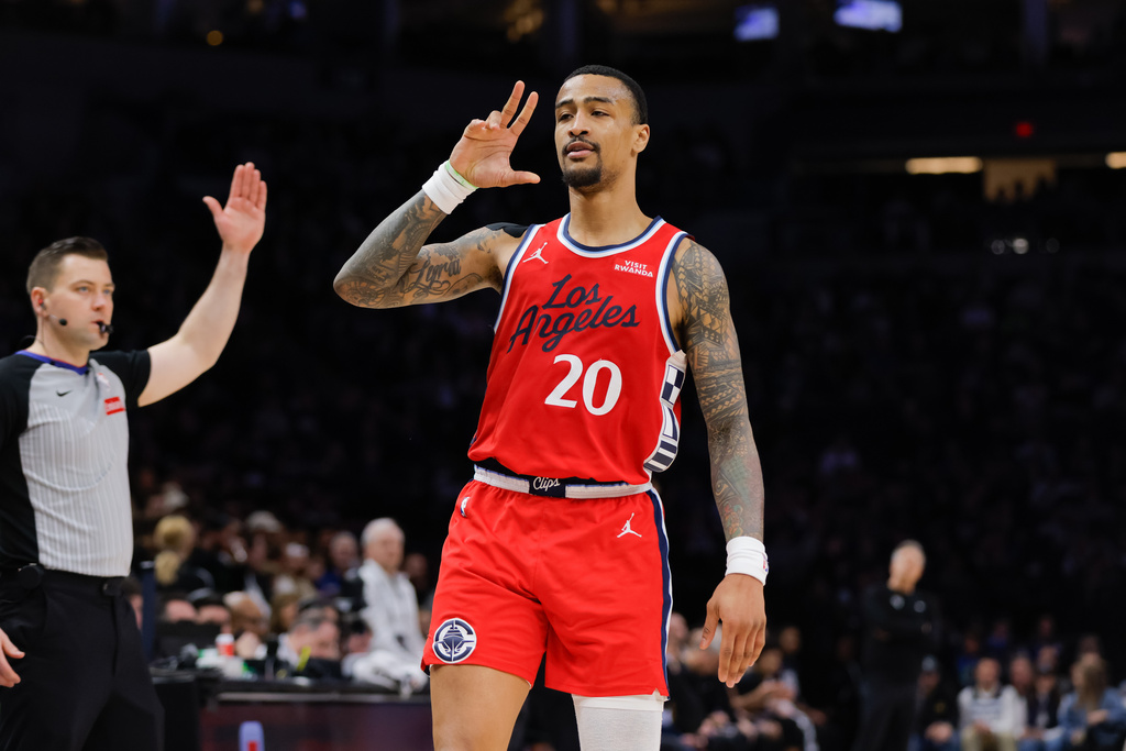 Los Angeles Clippers forward John Collins (20) celebrates after making a 3-point shot during the second half of an NBA basketball game against the Minnesota Timberwolves, Sunday, Feb. 8, 2026, in Minneapolis. (AP Photo/Bailey Hillesheim)