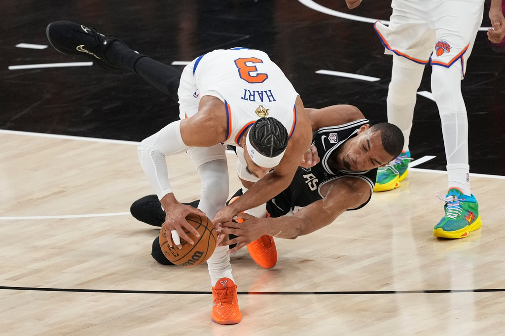 New York Knicks guard Josh Hart (3) steals the ball from San Antonio Spurs forward Victor Wembanyama during the second half of Game 1 of the NBA Finals basketball series, Wednesday, June 3, 2026, in San Antonio. (AP Photo/Eric Gay)