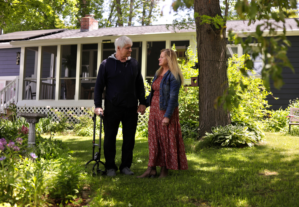Ron McConnell stands in his front yard with his wife, Amy, on Tuesday, June 2, 2026, in Vergennes, Vt. (AP Photo/Amanda Swinhart)