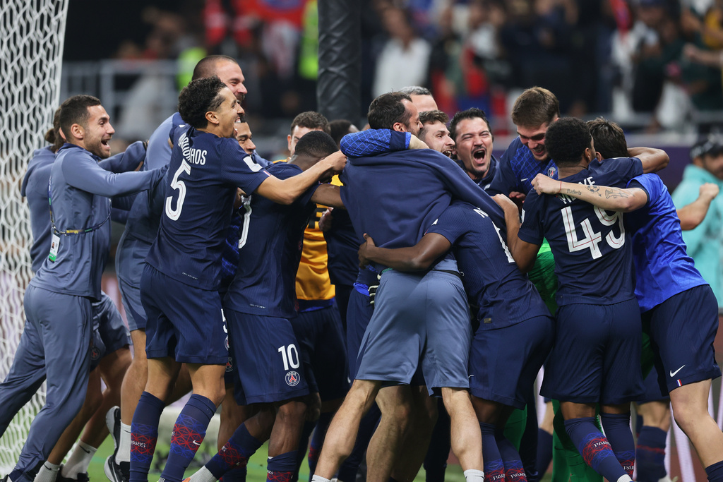 PSG players celebrate after winning the FIFA Intercontinental Cup final soccer match between Flamengo and Paris Saint-Germain in Doha, Qatar, Wednesday, Dec. 17, 2025. (AP Photo/Hussein Sayed)