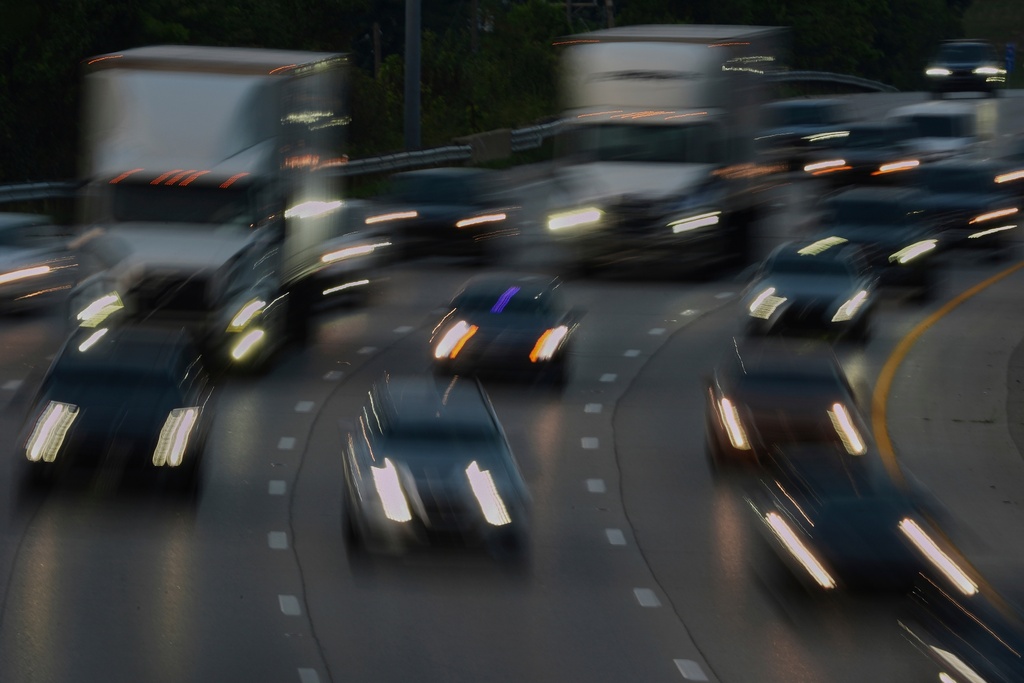 FILE - Vehicles drive along a highway July 30, 2025, in Cincinnati. (AP Photo/Joshua A. Bickel, File)