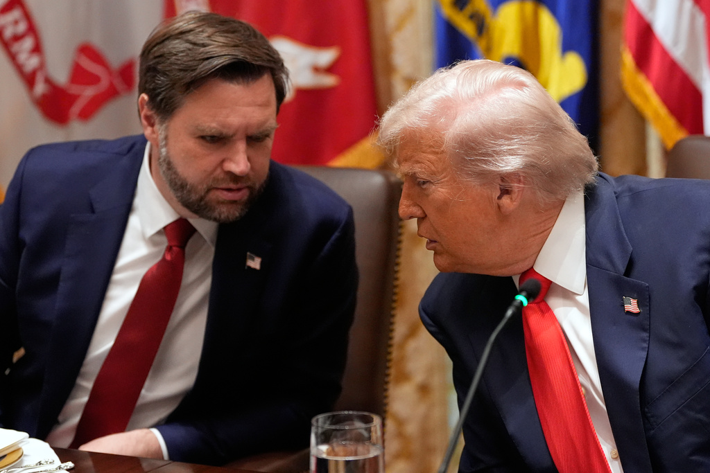 President Donald Trump listens to Vice President JD Vance during a meeting with Argentina's President Javier Milei in the Cabinet Room of the White House, Tuesday, Oct. 14, 2025, in Washington. (AP Photo/Alex Brandon)