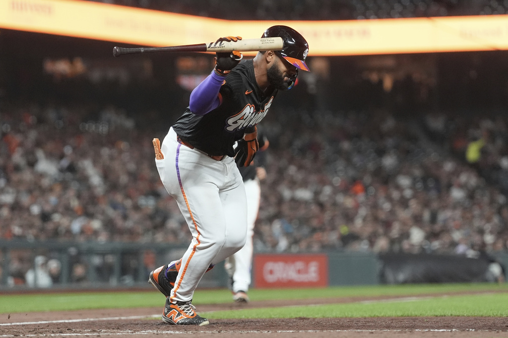 San Francisco Giants' Heliot Ramos throws his bat after popping out against the San Diego Padres during the sixth inning of a baseball game in San Francisco, Tuesday, Aug. 12, 2025. (AP Photo/Jeff Chiu)
