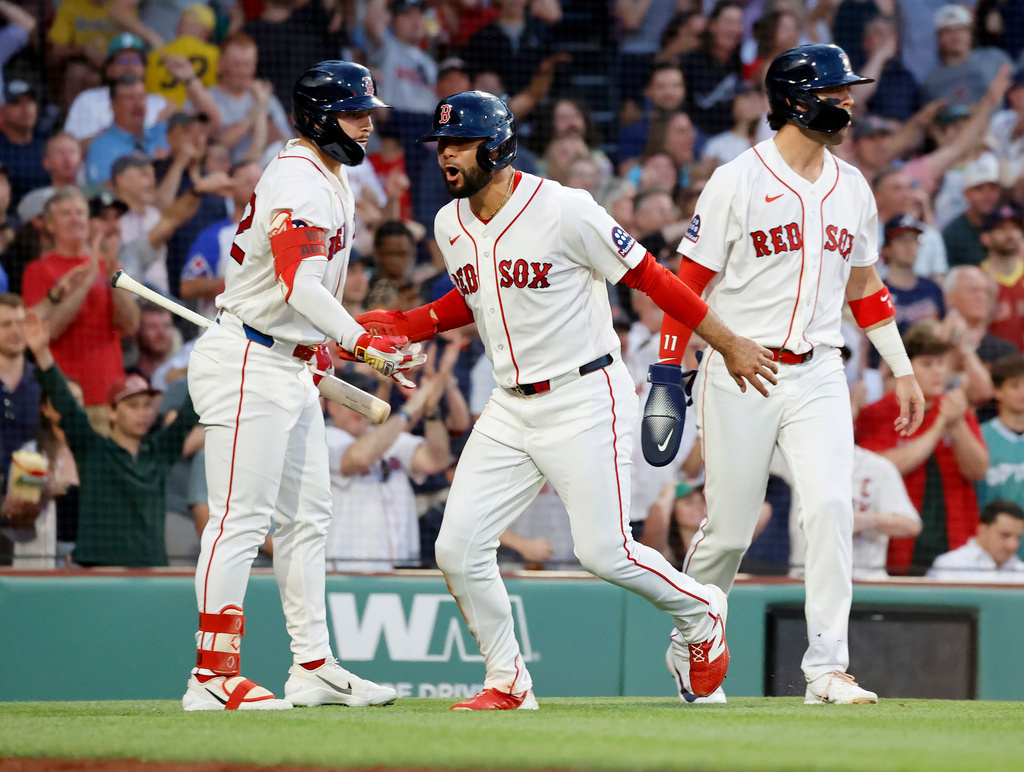 Boston Red Sox Isiah Kiner-Falefa, center, celebrates with teammates Wilyer Abreu, left, and Marcelo Mayer (11) after scoring on a single by Ceddanne Rafaela during the fourth inning of a baseball game against the Atlanta Braves, Wednesday, May 27, 2026, in Boston. (AP Photo/Mary Schwalm)