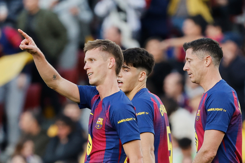 Barcelona's Dani Olmo celebrates after scoring his side's second goal during a Spanish La Liga soccer match between Barcelona and Alaves, in Barcelona, Spain, Saturday, Nov. 29, 2025. (AP Photo/Joan Monfort)