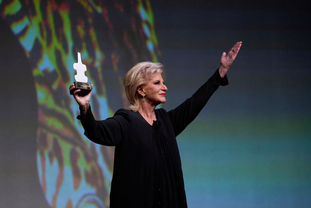 Renowned Greek mezzo-soprano Agnes Baltsa greets the audience with a wave after being honored with a Lifetime Achievement Award at the International Opera Awards, held at the Greek National Opera, in Athens, Thursday, Nov. 13, 2025. (AP Photo/Petros Giannakouris)