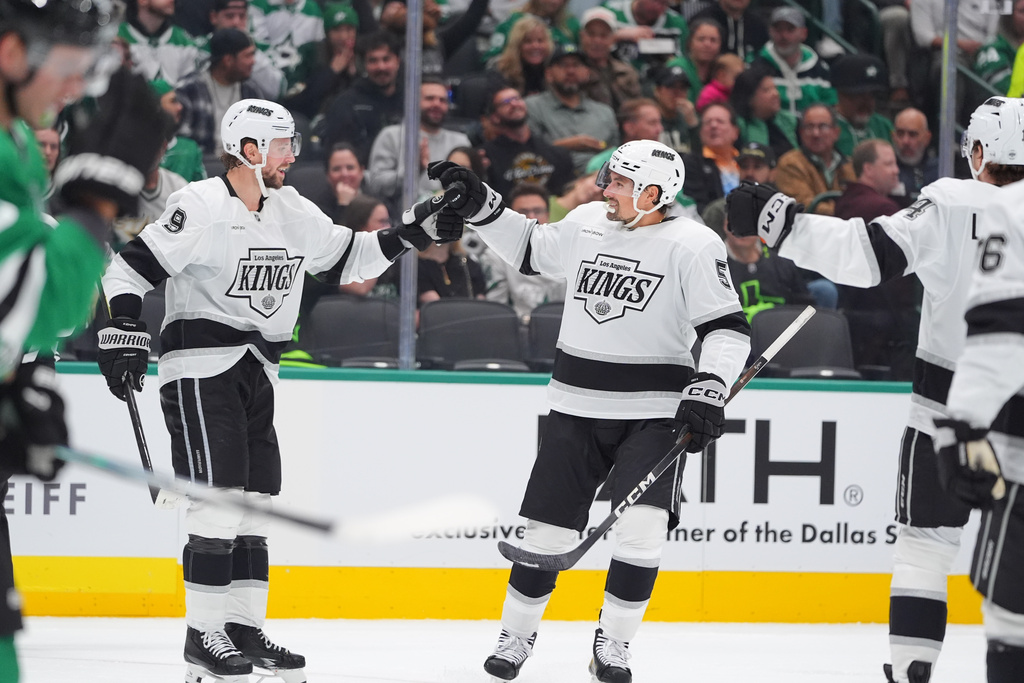 Los Angeles Kings defenseman Cody Ceci (5) celebrates scoring a goal with teammate right wing Adrian Kempe (9) during the second period of an NHL hockey game against the Dallas Stars Thursday, Oct. 23, 2025, in Dallas. (AP Photo/LM Otero)
