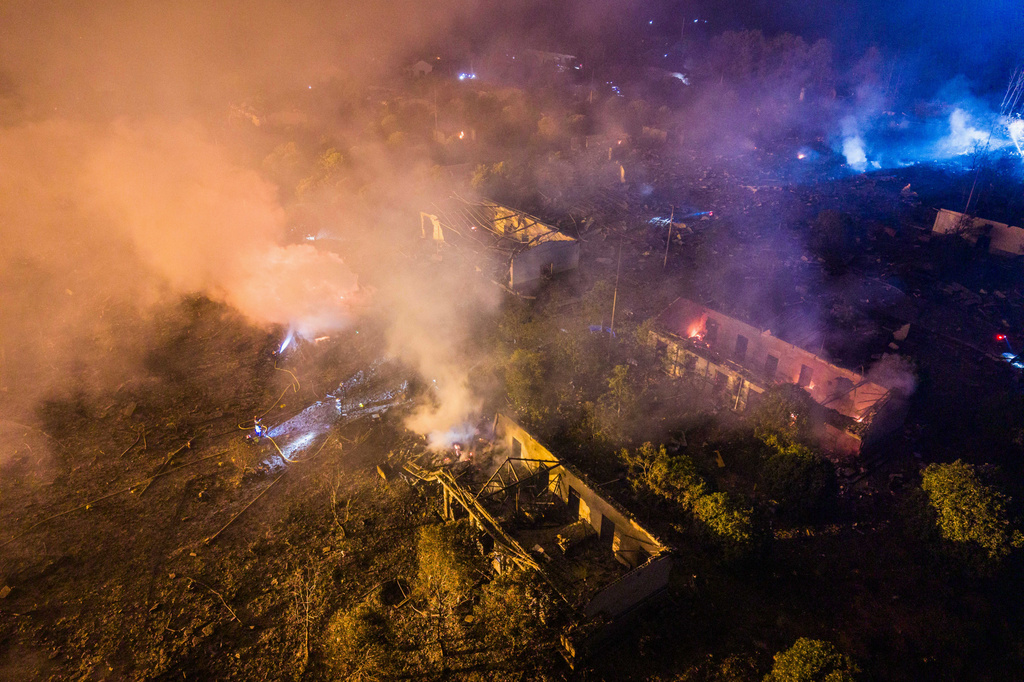 In this photo released by Xinhua News Agency, this aerial drone photo taken in the early hours of May 5, 2026, rescuers work on site after an explosion at a fireworks plant in Guandu Town of Liuyang, central China's Hunan Province.(Chen Sihan/Xinhua via AP)