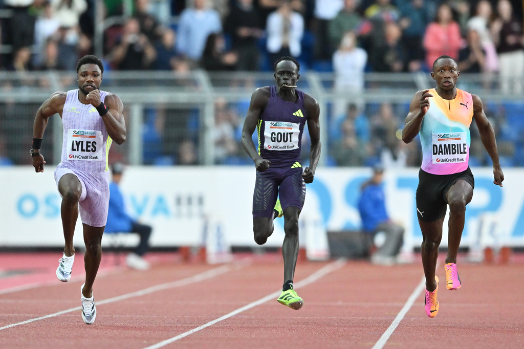 Noah Lyles of United States, left, Gout Gout of Australia and Sinesipho Dambile of South Africa, right, compete during the men's 150 meters event at the Golden Spike athletics meeting in Ostrava, Czech Republic, Tuesday, June 16, 2026. (AP Photo/Lukas Kabon)