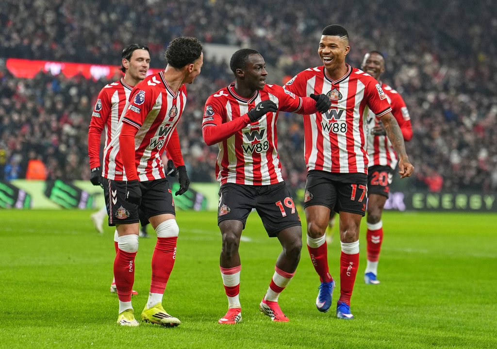 Sunderland's Habib Diarra celebrates with teammates after scoring a goal during a Premier League soccer match against Burnley at the Stadium of Light in Sunderland, Monday, Feb. 2, 2026. (Martin Rickett/PA via AP)