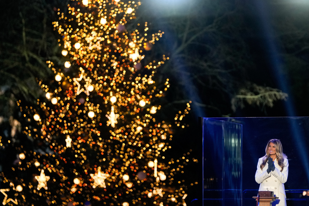 First lady Melania Trump claps after lighting the National Christmas Tree on the Ellipse, Thursday, Dec. 4, 2025, near the White House in Washington. (AP Photo/Julia Demaree Nikhinson)