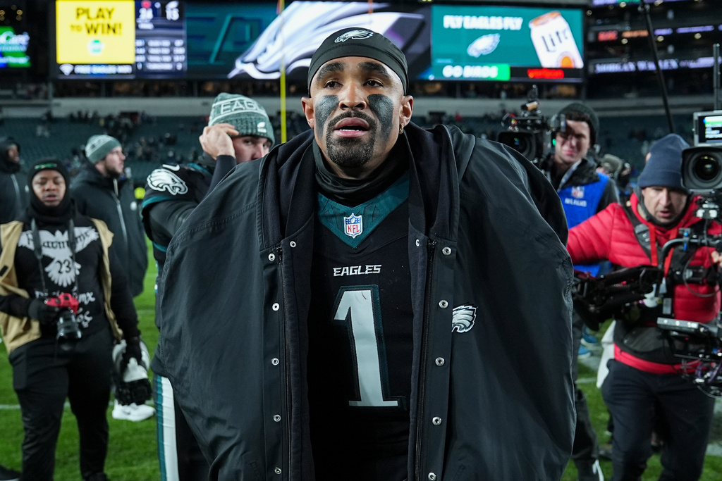 Philadelphia Eagles quarterback Jalen Hurts (1) leaves the field after his team's loss to the Chicago Bears in an NFL football game, Friday, Nov. 28, 2025, in Philadelphia. (AP Photo/Matt Rourke)