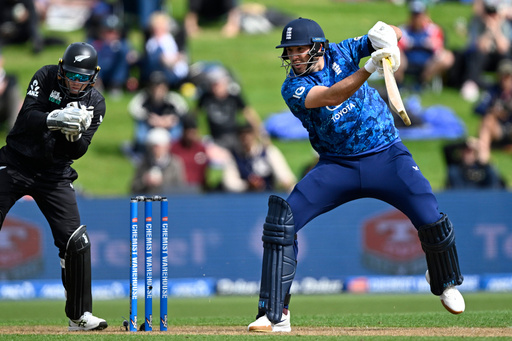 England's Jamie Overton, right, bats in front of New Zealand's Tom Latham during their T20 cricket match in Hamilton, New Zealand, Wednesday, Oct. 29, 2025. (Andrew Cornaga/Photosport via AP) England's Jamie Overton, right, bats in front of New Zealand's Tom Latham during their T20 cricket match in Hamilton, New Zealand, Wednesday, Oct. 29, 2025. (Andrew Cornaga/Photosport via AP)
