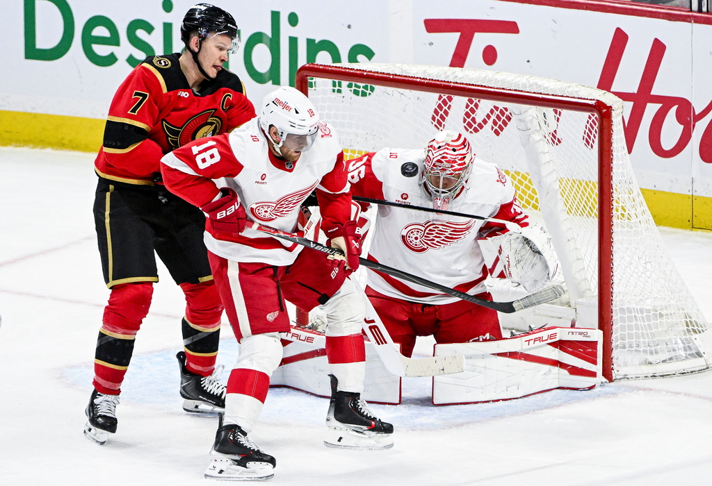Detroit Red Wings' goaltender John Gibson (36) makes a save while under pressure from Ottawa Senators' Brady Tkachuk (7) during the third period of an NHL hockey game, in Ottawa, Ontario, Thursday, Feb. 26, 2026. (Spencer Colby/The Canadian Press via AP)