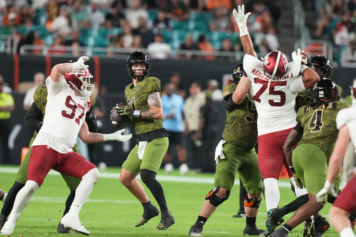Miami quarterback Carson Beck, center, stands back to pass during the first half of an NCAA college football game against Stanford, Saturday, Oct. 25, 2025, in Miami Gardens, Fla. (AP Photo/Lynne Sladky) Miami quarterback Carson Beck, center, stands back to pass during the first half of an NCAA college football game against Stanford, Saturday, Oct. 25, 2025, in Miami Gardens, Fla. (AP Photo/Lynne Sladky)
