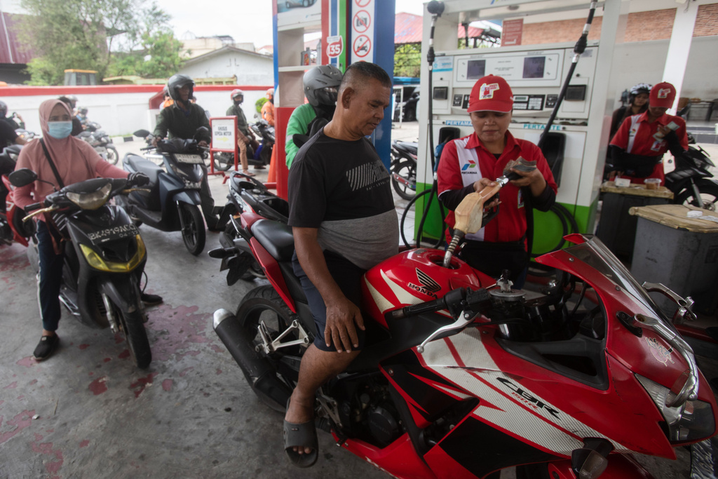 Motorists queue up to fill up their tank at a a petrol station in Medan, North Sumatra, Indonesia, on March 3, 2026. (AP Photo/Binsar Bakkara)