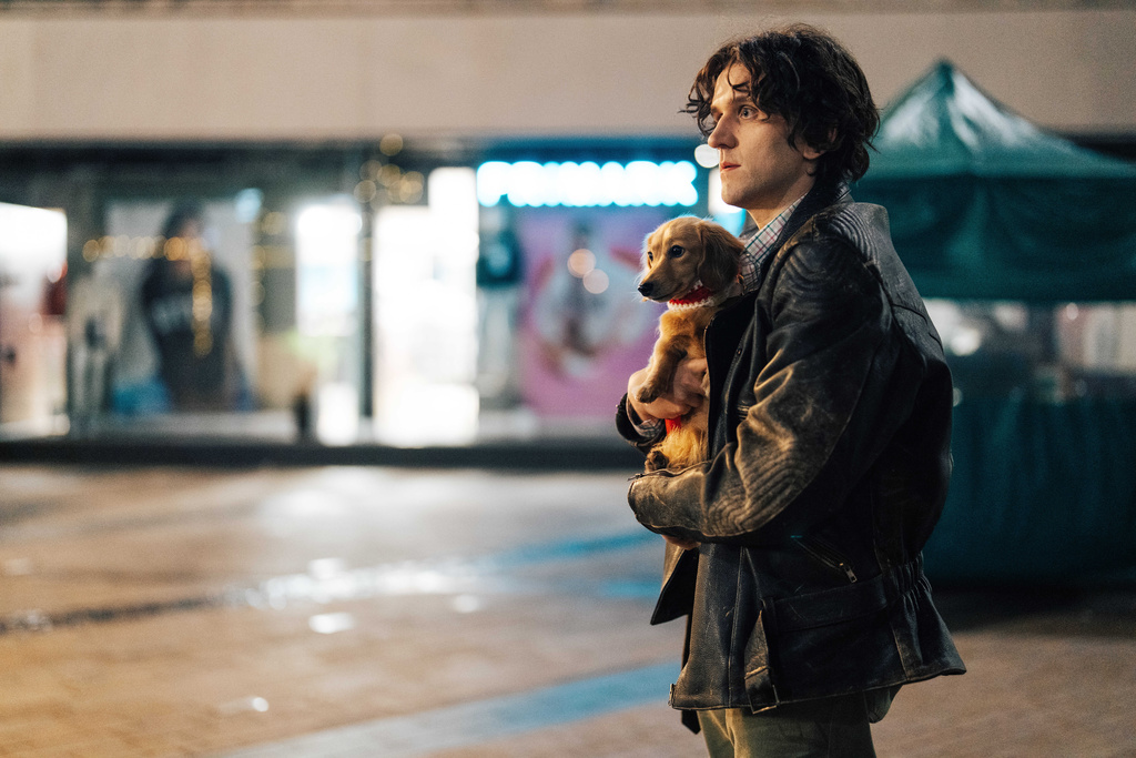 This image released by A24 shows Harry Melling in a scene from "Pillion." (Chris Harris/A24 via AP)
