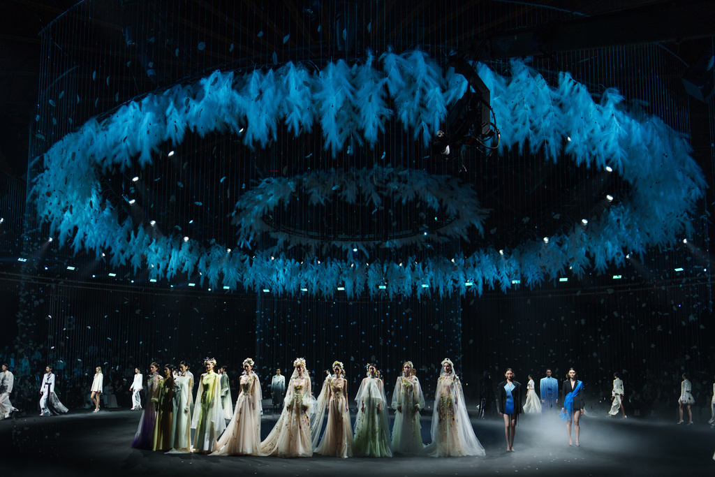 Models wear creations by Xiong Ying - Heaven Gala during China Fashion Week (Spring) 2026 in Beijing, China, Friday, March 20, 2026. (AP Photo/Vincent Thian)