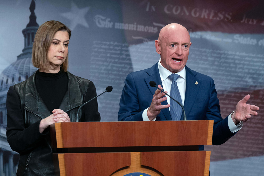 Rep. Elissa Slotkin, D-Mich., and Sen. Mark Kelly, D-Ariz., speak during a news conference at Capitol Hill, Wednesday, Feb. 11, 2026, in Washington. (AP Photo/Jose Luis Magana)