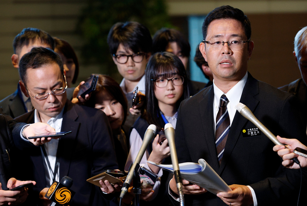 Okinawa Governor Genta Koja speaks to reporters after his meeting with Japanese Prime Minister Sanae Takaichi at the prime minister's office in Tokyo, Japan, Wednesday, Oct.7, 2026. (Franck Robichon/Pool Photo via AP)