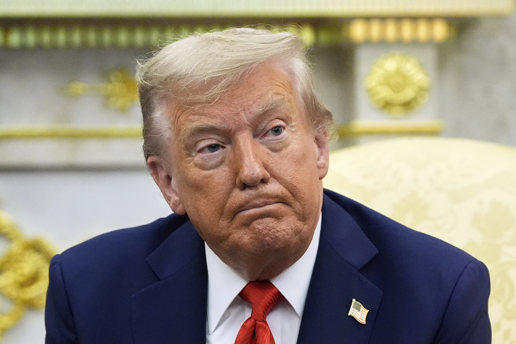 FILE - President Donald Trump listens during a meeting with South Korean President Lee Jae Myung in the Oval Office of the White House, Aug. 25, 2025, in Washington. (AP Photo/Alex Brandon, File)