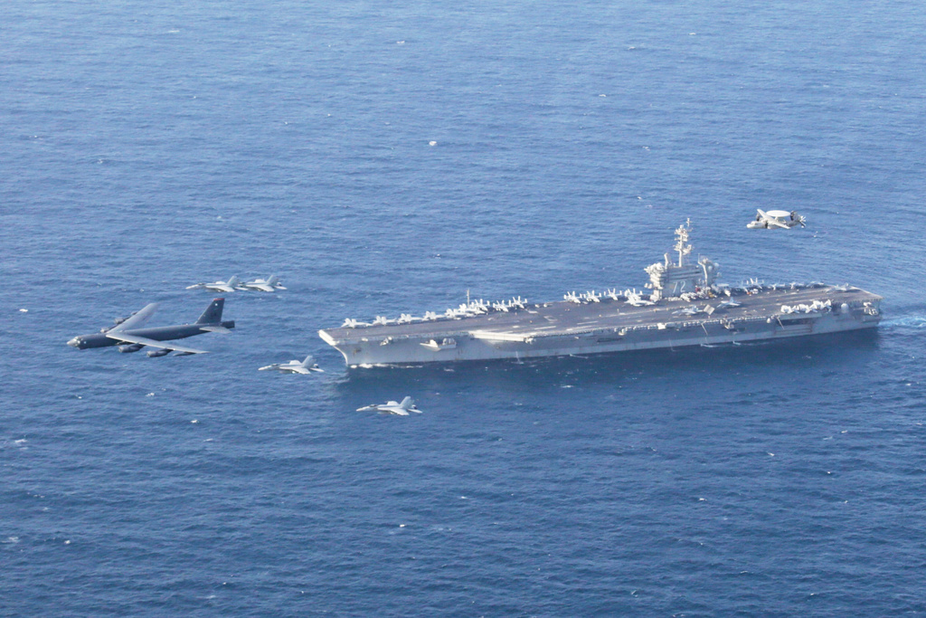 FILE - The USS Abraham Lincoln carrier and a U.S. Air Force B-52H Stratofortress, conduct joint exercises in the U.S. Central Command area of responsibility in Arabian Sea June 1, 2019. (Mass Communication Specialist 1st Class Brian M. Wilbur/U.S. Navy via AP, File)