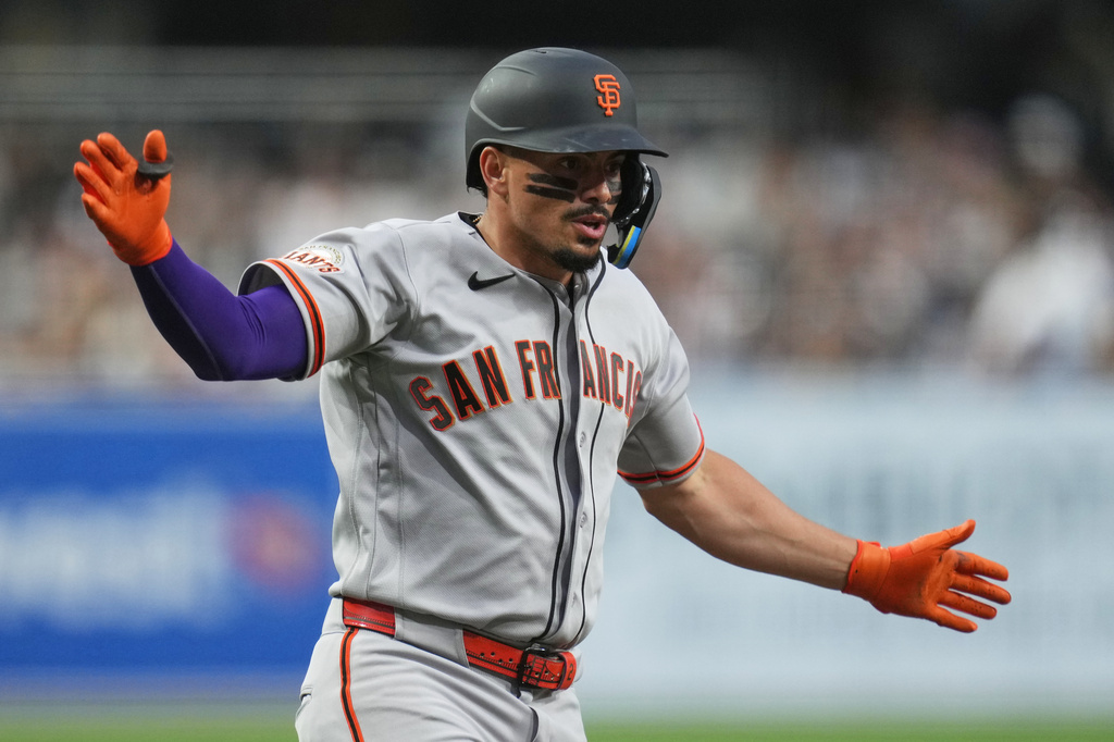 San Francisco Giants' Willy Adames celebrates his home run during the first inning of a baseball game against the San Diego Padres Tuesday, March 31, 2026, in San Diego. (AP Photo/Gregory Bull)