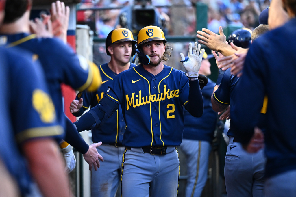Milwaukee Brewers' Brice Turang is greeted by teammates after hitting a two-run home run during the fifth inning of a baseball game against the Los Angeles Angels, Friday, July 31, 2026, in Anaheim, Calif. (AP Photo/William Liang)