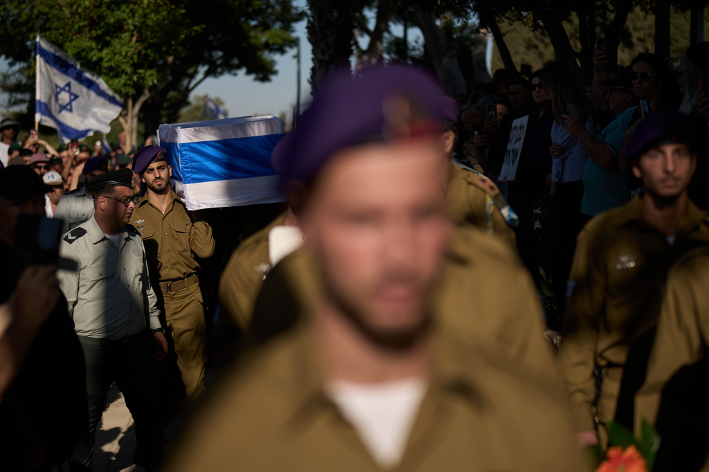 Israeli soldiers carry the coffin of Staff-Sergeant Michael Tyukin, who was killed in a drone attack in southern Lebanon, during his funeral in Ashkelon, Israel, Monday, June 1, 2026. (AP Photo/Leo Correa)