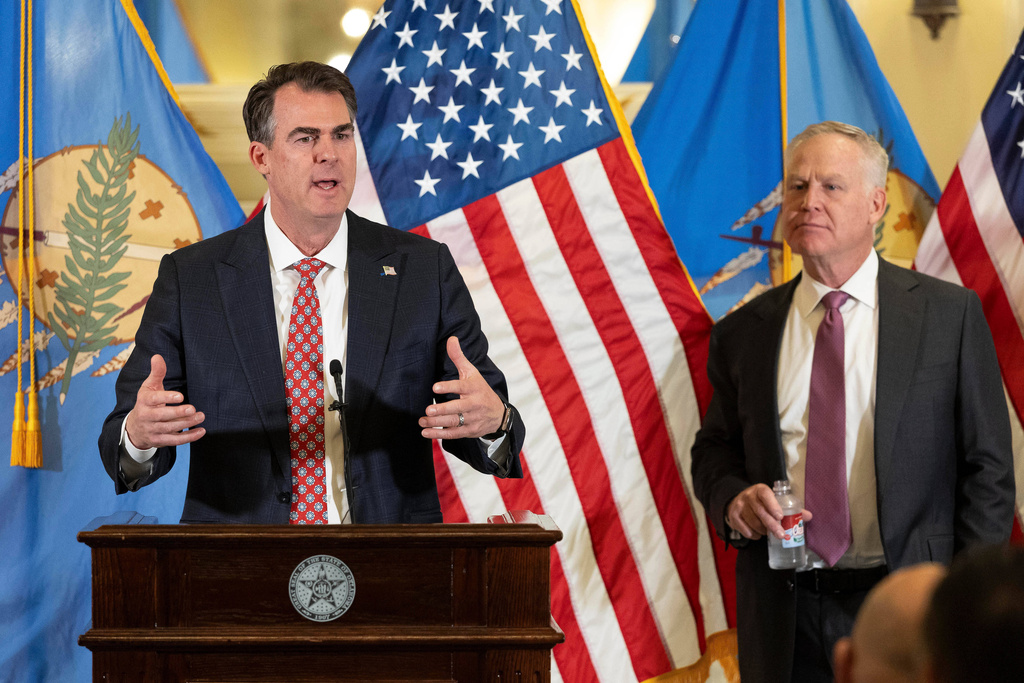 Oklahoma Governor Kevin Stitt and his appointee to the U.S. Senate, Alan Armstrong speaks to state leaders, reporters, and friends after he was announced by Oklahoma Governor Kevin Stitt's as his choice to temporarily fill Senator Markwayne Mullin's seat during a press conference at the Oklahoma State Capitol in Oklahoma City, Tuesday, March 24, 2026, Oklahoma City. (AP Photo/Alonzo Adams)