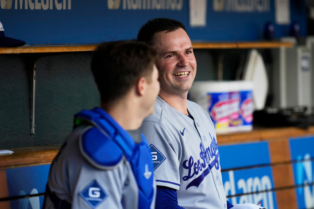 Los Angeles Dodgers pitcher Tarik Skubal smiles in the dugout against the Detroit Tigers during the first inning of a baseball game Friday, Aug. 28, 2026, in Detroit. (AP Photo/Paul Sancya)