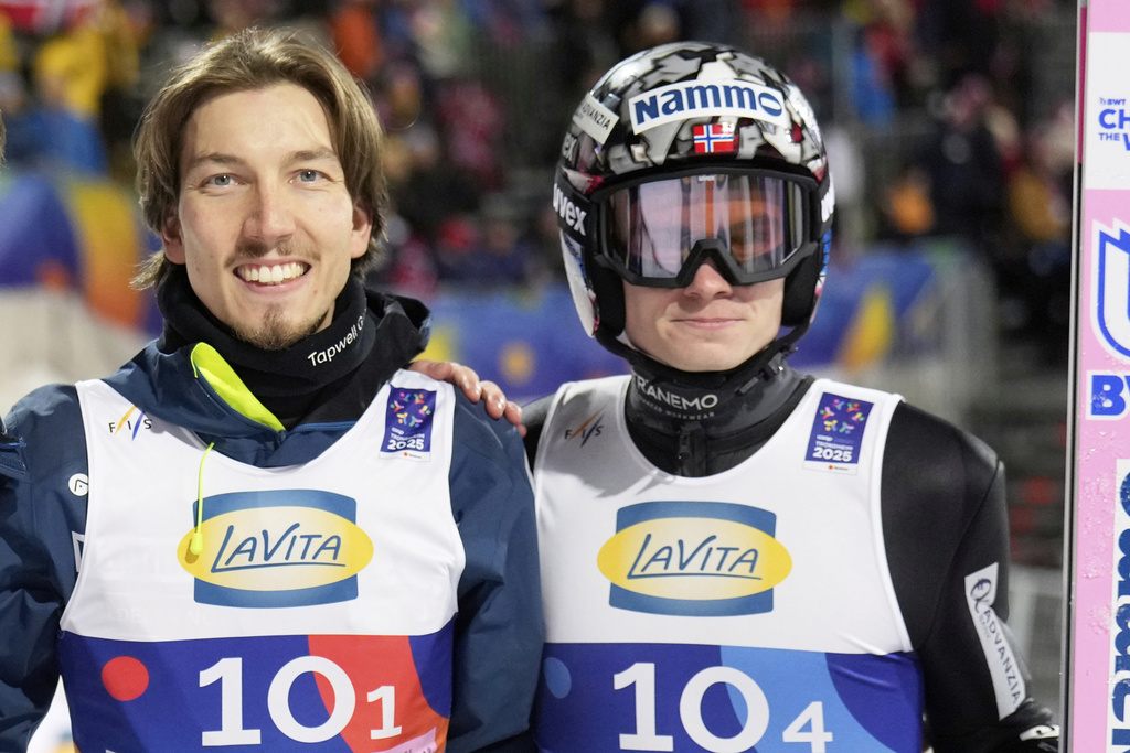 FILE - Johann Andre Forfang, and Marius Lindvik, from left, of Norway, pose after winning the bronze medal in the ski jumping men's team large hill competition at the Nordic World Ski Championships in Trondheim, Norway, Thursday, March 6, 2025. (AP Photo/Matthias Schrader, File)
