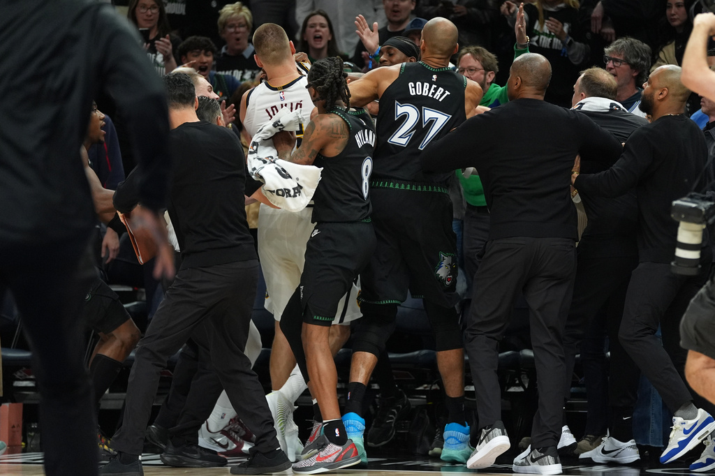 Minnesota Timberwolves and Denver Nuggets players get into an altercation during the second half of Game 4 of a first-round NBA basketball playoff series, Saturday, April 25, 2026, in Minneapolis. (AP Photo/Abbie Parr)